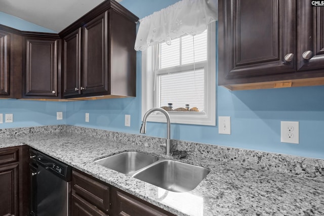 kitchen featuring light stone counters, sink, dishwasher, and dark brown cabinets