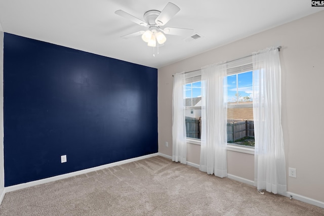 carpeted empty room with ceiling fan