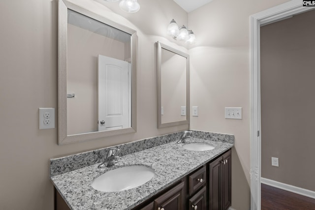 bathroom featuring hardwood / wood-style floors and vanity