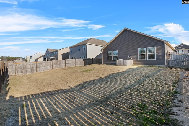 rear view of property with a lawn