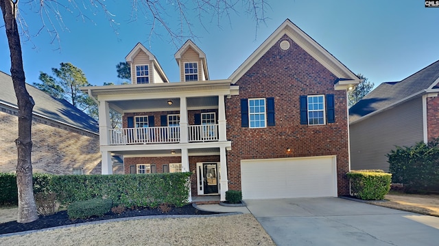 view of front of house with a balcony and a garage