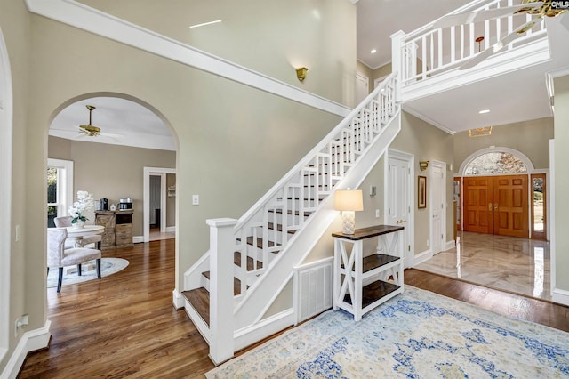 106 Stonebrook Dr, Blythewood, SC 29016 - staircase featuring ceiling fan, a high ceiling, and hardwood / wood-style floors