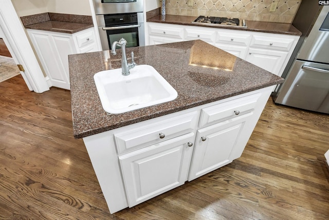 106 Stonebrook Dr, Blythewood, SC 29016 - kitchen with sink, a center island with sink, white cabinetry, and appliances with stainless steel finishes