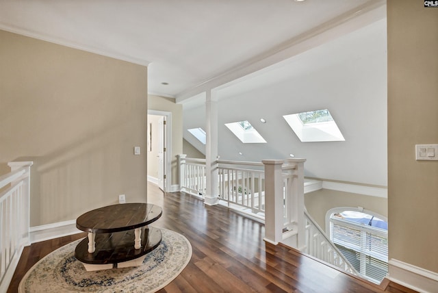 106 Stonebrook Dr, Blythewood, SC 29016 - interior space featuring dark hardwood / wood-style floors, lofted ceiling with skylight, and ornamental molding