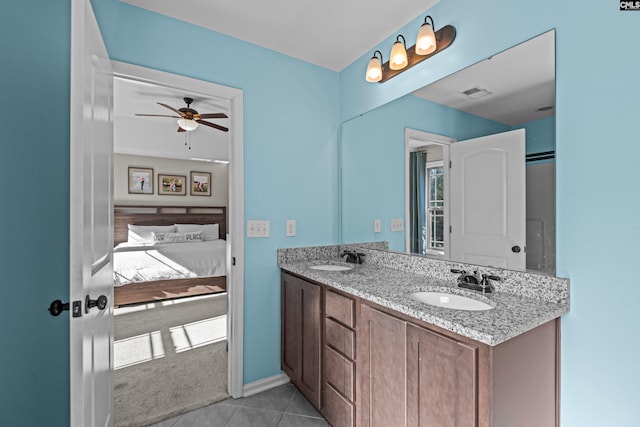 bathroom with ceiling fan, tile patterned floors, and vanity