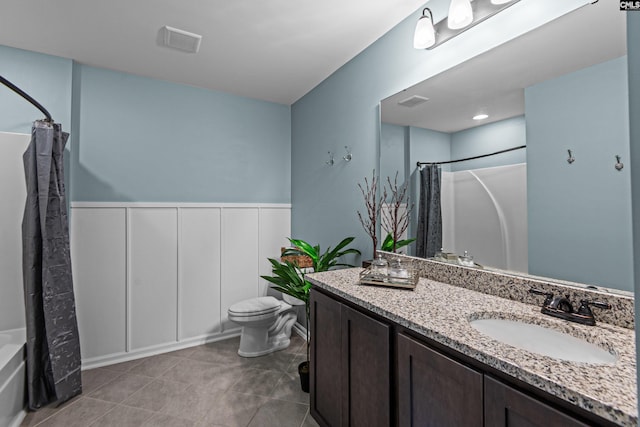 full bathroom with vanity, tile patterned flooring, shower / bath combination with curtain, and toilet