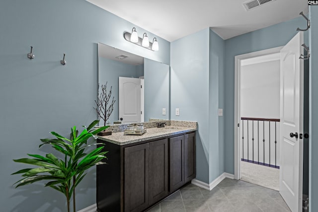 bathroom with vanity and tile patterned flooring