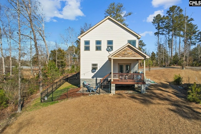 rear view of house with a deck