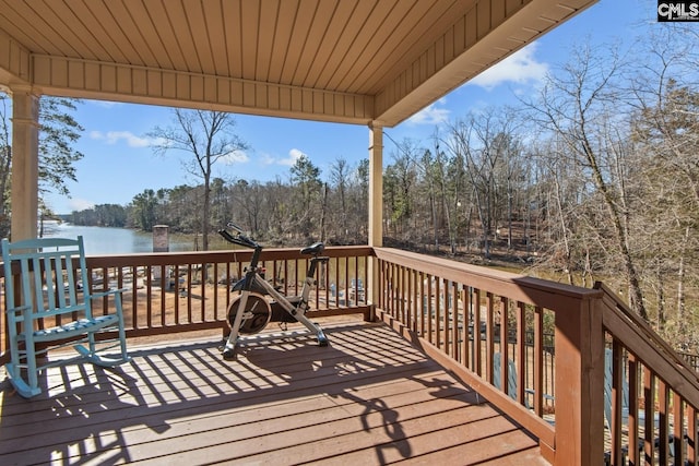 wooden deck featuring a water view