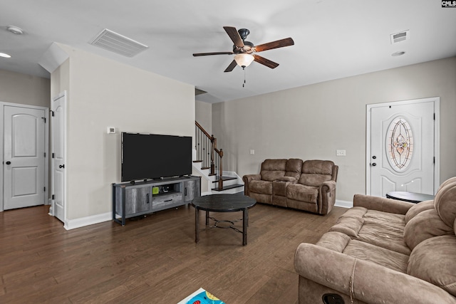 living room with ceiling fan and dark hardwood / wood-style floors