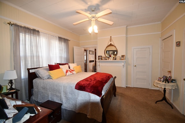 carpeted bedroom featuring crown molding and ceiling fan