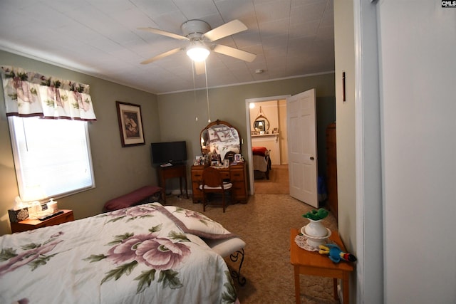 bedroom with crown molding, carpet floors, and ceiling fan