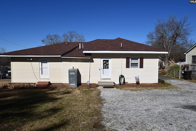 back of house with a yard