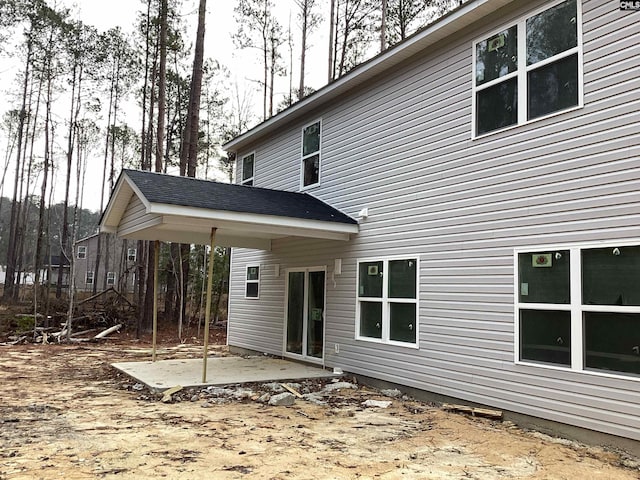 rear view of property featuring a patio area