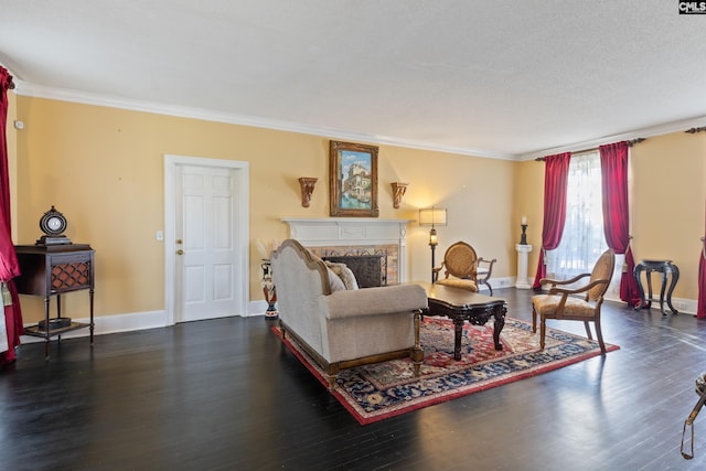 living room featuring a textured ceiling, dark hardwood / wood-style flooring, and ornamental molding