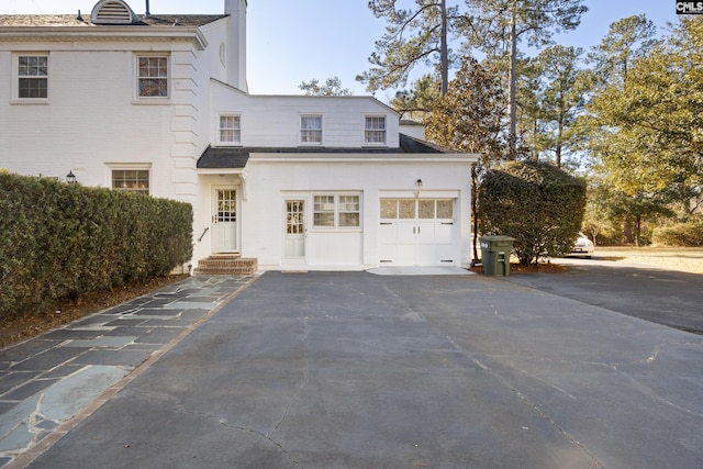 exterior space with a garage