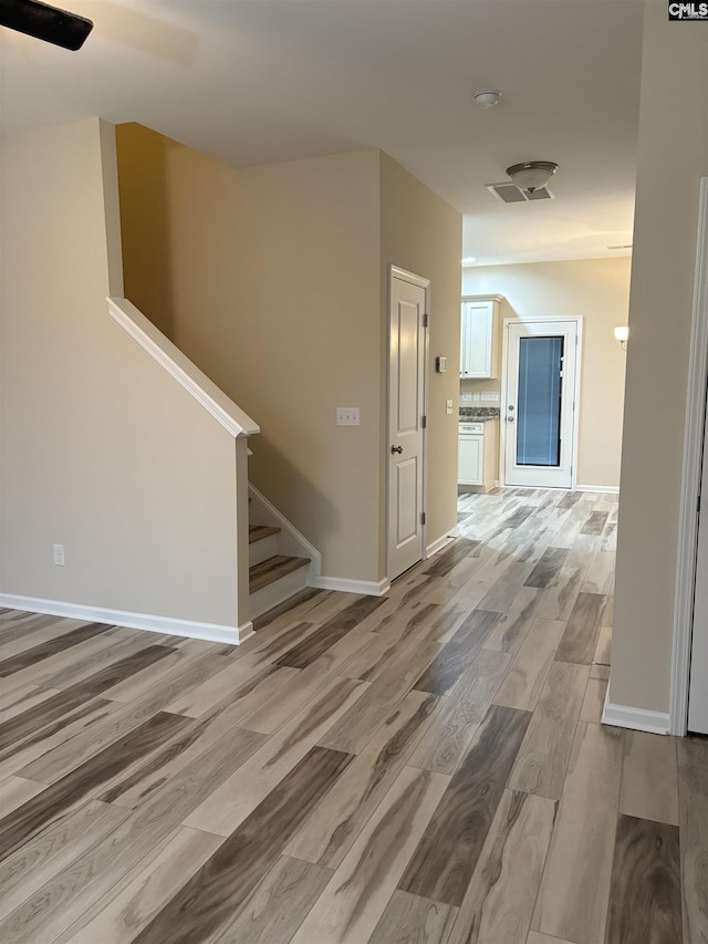 hall featuring wood-type flooring