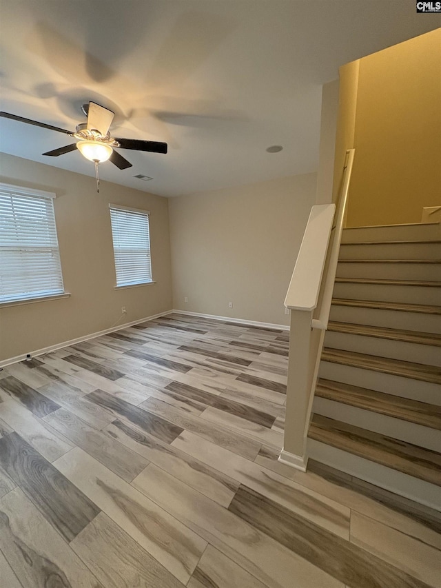 spare room with light hardwood / wood-style flooring and ceiling fan