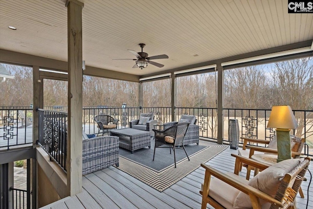 sunroom / solarium with ceiling fan