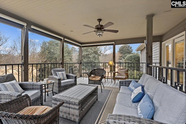 sunroom / solarium with plenty of natural light and ceiling fan