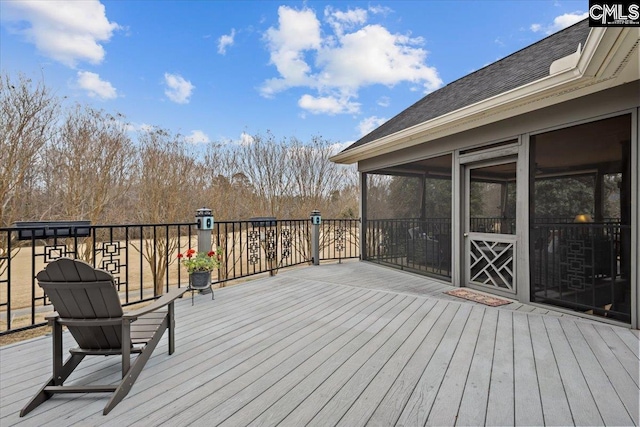 deck with a sunroom