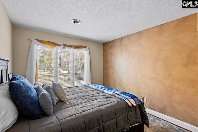 bedroom featuring a textured ceiling