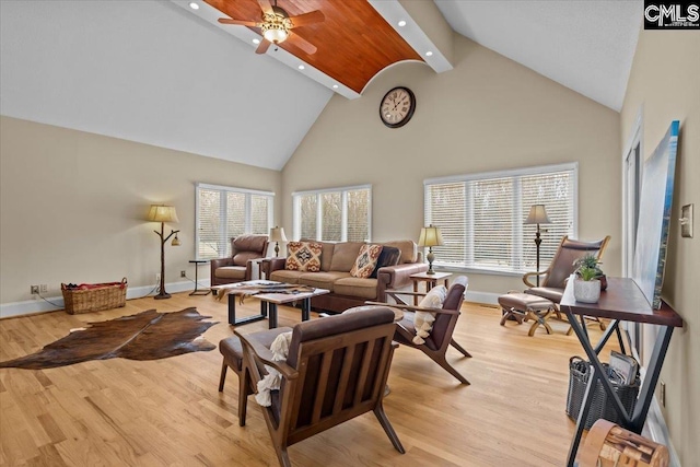 living room with ceiling fan, high vaulted ceiling, and light hardwood / wood-style floors