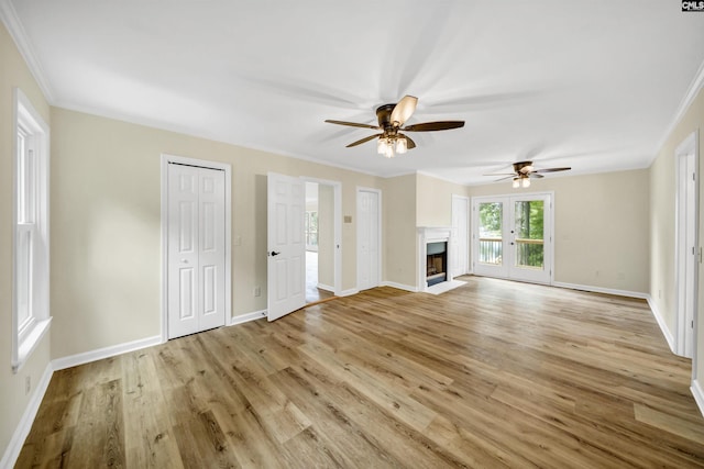 unfurnished living room featuring light wood-type flooring and crown molding