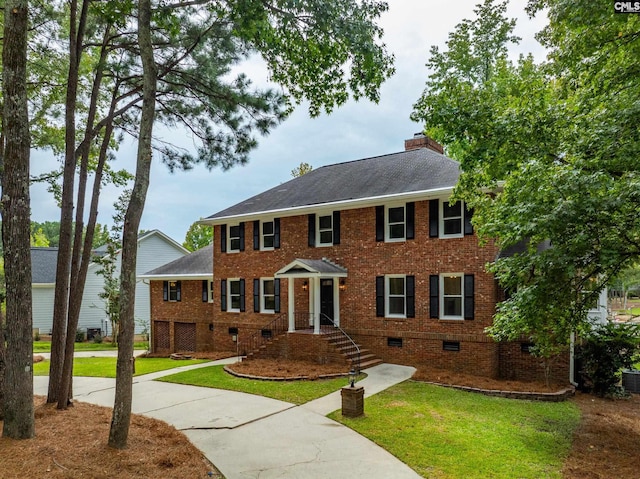 colonial home with a front yard