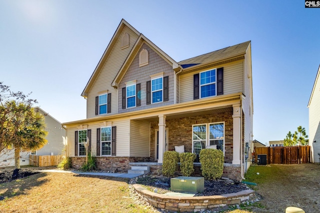 craftsman-style house featuring a porch and cooling unit