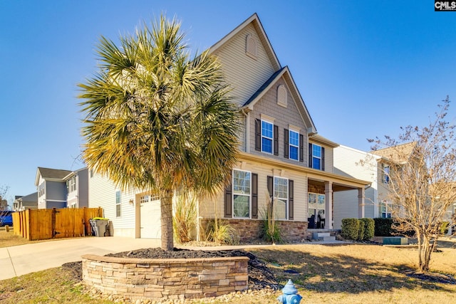 view of front of property featuring a garage and a porch