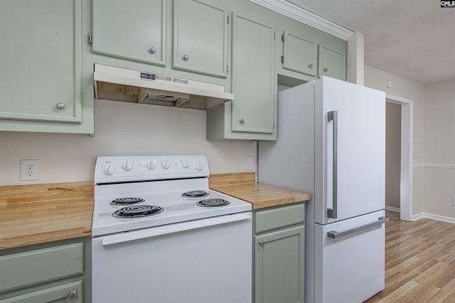 kitchen featuring white appliances, green cabinetry, and light wood-type flooring