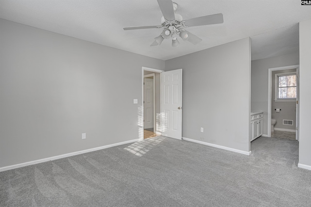 unfurnished bedroom with ceiling fan and light carpet