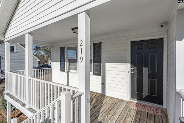 view of exterior entry with covered porch