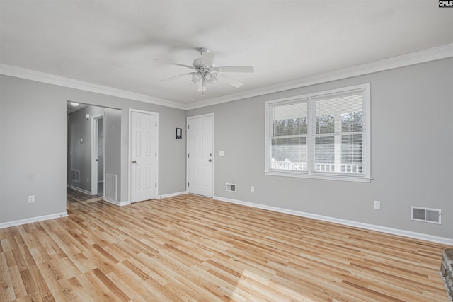 spare room featuring ceiling fan, light hardwood / wood-style flooring, and crown molding