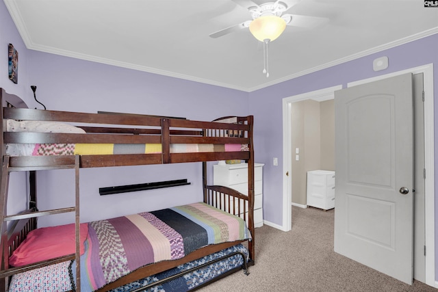 carpeted bedroom with crown molding and ceiling fan