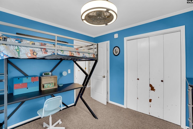 bedroom with a closet, ornamental molding, and carpet floors