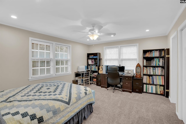 bedroom featuring light carpet, ceiling fan, and crown molding