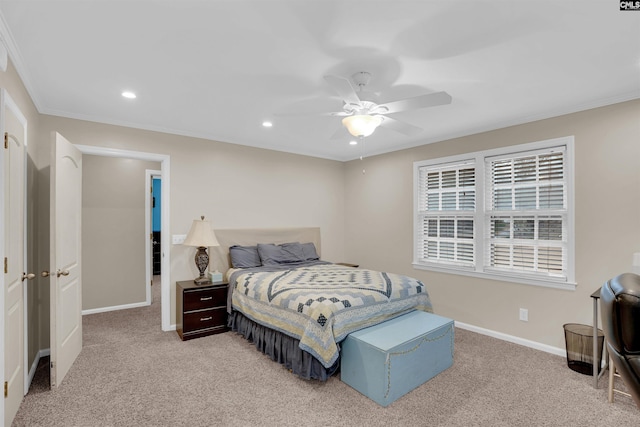 bedroom with light carpet, ceiling fan, and crown molding