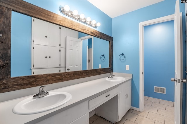 bathroom featuring tile patterned floors and vanity