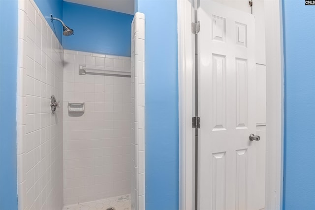 bathroom with tiled shower