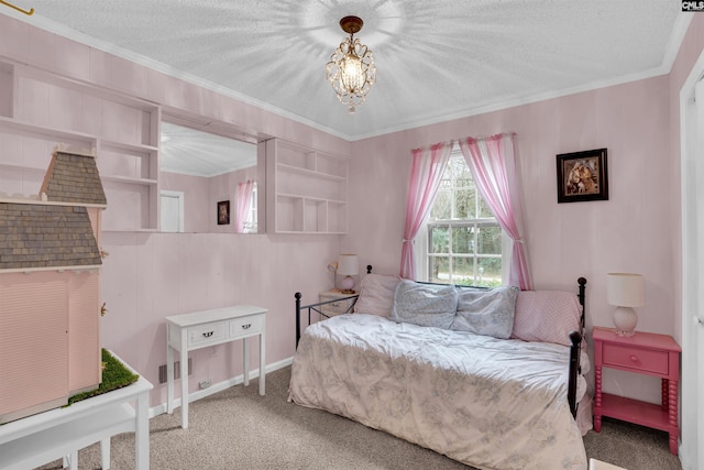 bedroom with a textured ceiling, crown molding, and carpet flooring