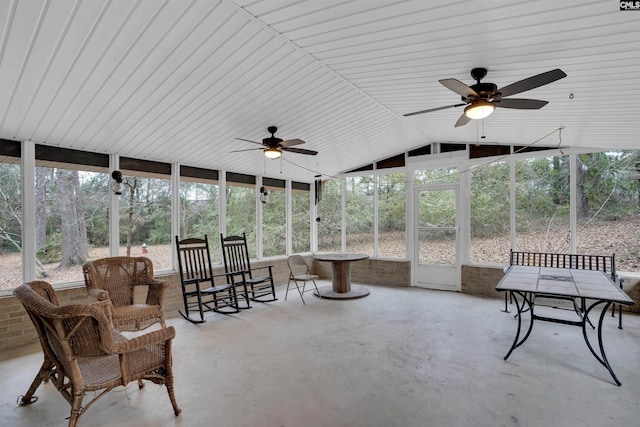 sunroom with vaulted ceiling, ceiling fan, and plenty of natural light