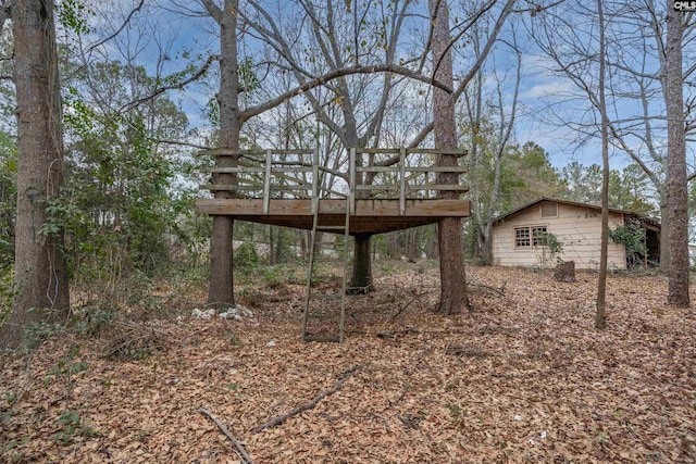 view of yard with a wooden deck