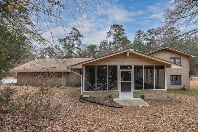 rear view of house with a sunroom