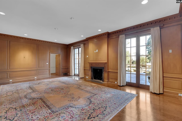 living room with french doors and ornamental molding