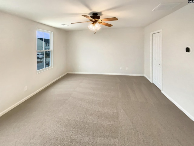 carpeted empty room with ceiling fan