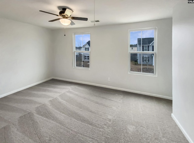 empty room with carpet floors and ceiling fan