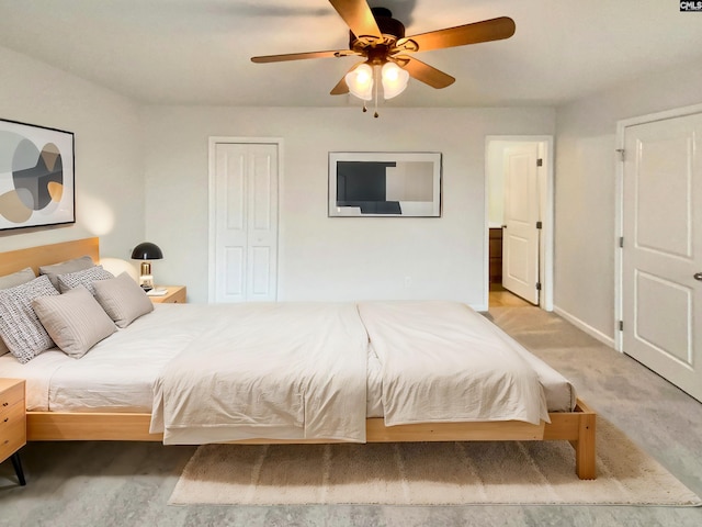 bedroom with light carpet, a closet, and ceiling fan