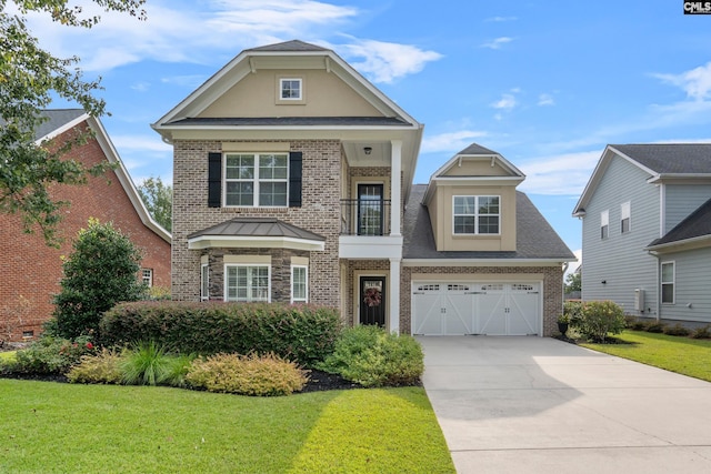 view of front of home featuring a balcony, a front yard, and a garage